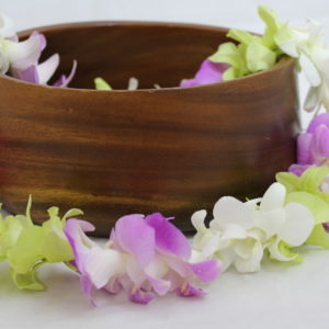 white, green, purple orchid lei