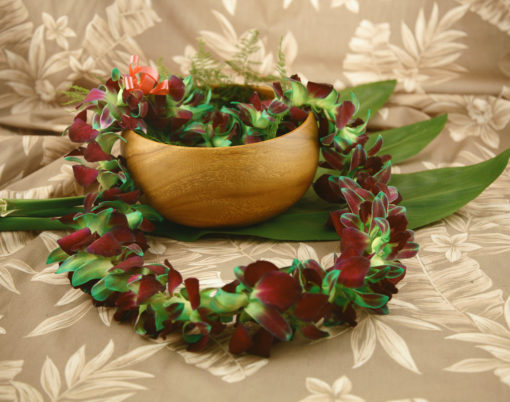 green tinted orchid lei